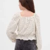 Partes de arriba infantiles con peplum arrugado