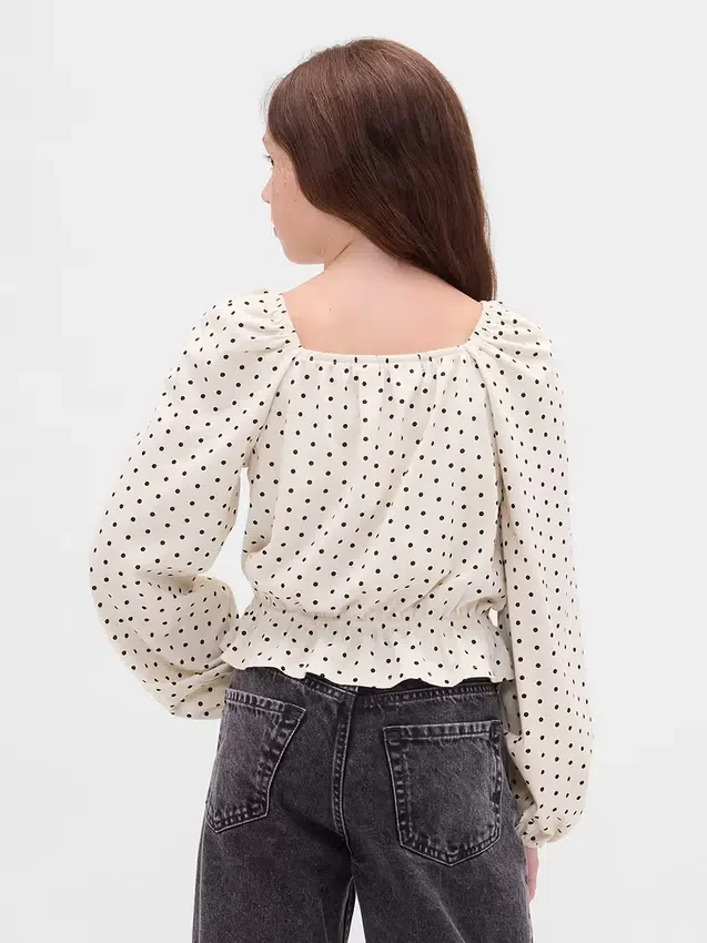 Partes de arriba infantiles con peplum arrugado