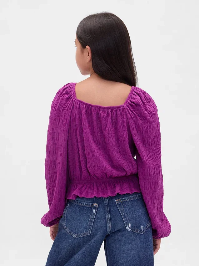 Partes de arriba infantiles con peplum arrugado