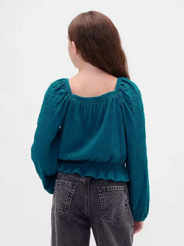Partes de arriba infantiles con peplum arrugado