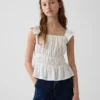 Partes de arriba infantiles con peplum, mangas con volantes y fruncido