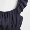 Partes de arriba infantiles con peplum, mangas con volantes y fruncido