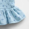 Partes de arriba infantiles de gasa de algodón con peplum fruncido