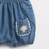 Peto tipo burbuja de denim para bebé con bolsillos de parche
