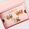 Set de dijes superventas de Pierced Co
