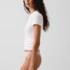 Tanga de algodón orgánico elástico con ribete de encaje