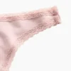 Tanga de algodón orgánico elástico con ribete de encaje