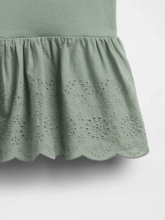 Top con dobladillo de ojales para bebés y niños pequeños