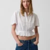 Top corto con peplum de gasa de algodón