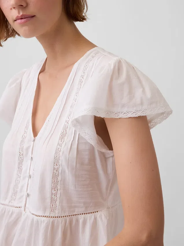 Top corto con peplum de gasa de encaje
