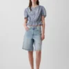 Top corto con peplum y cierre frontal de botones