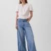 Top corto con peplum y cierre frontal de botones