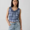 Top corto con peplum y lazo delantero con ojales