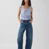 Top corto con peplum y lazo delantero con ojales