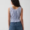 Top corto con peplum y lazo delantero con ojales