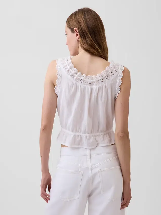 Top corto con peplum y lazo delantero con ojales