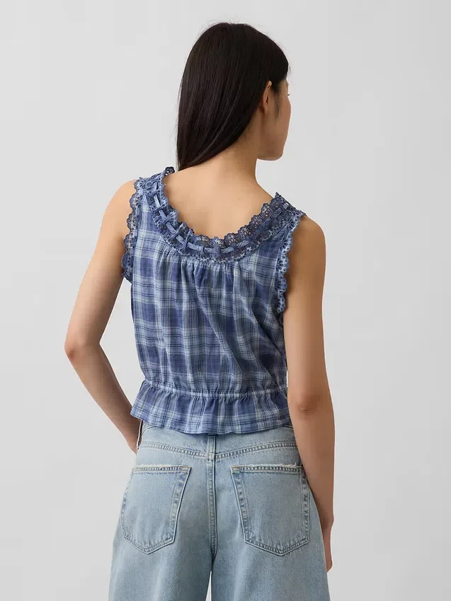 Top corto con peplum y lazo delantero con ojales