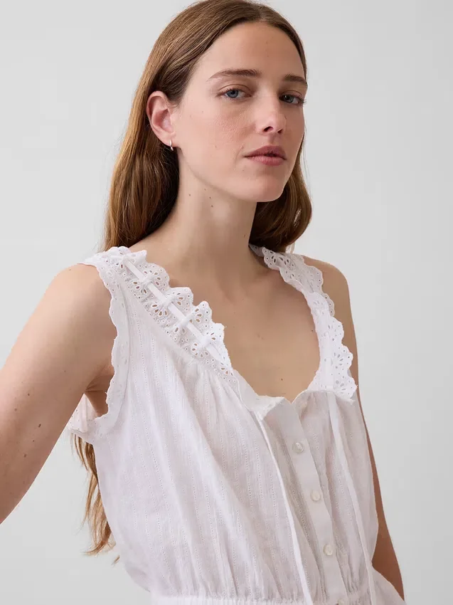 Top corto con peplum y lazo delantero con ojales