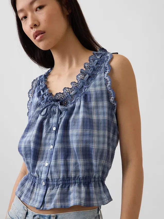 Top corto con peplum y lazo delantero con ojales