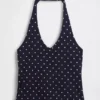 Top corto de cuello halter de punto tupido