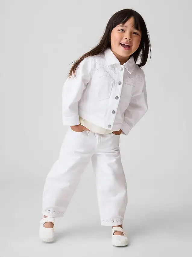 Vaqueros con bajo de ojales y diseño de herradura para Bebé y Niño