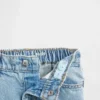 Vaqueros Stride con bajo con volantes para bebés y niños pequeños