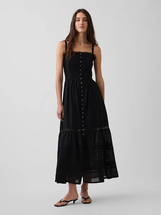 Vestido largo con volantes y ojales